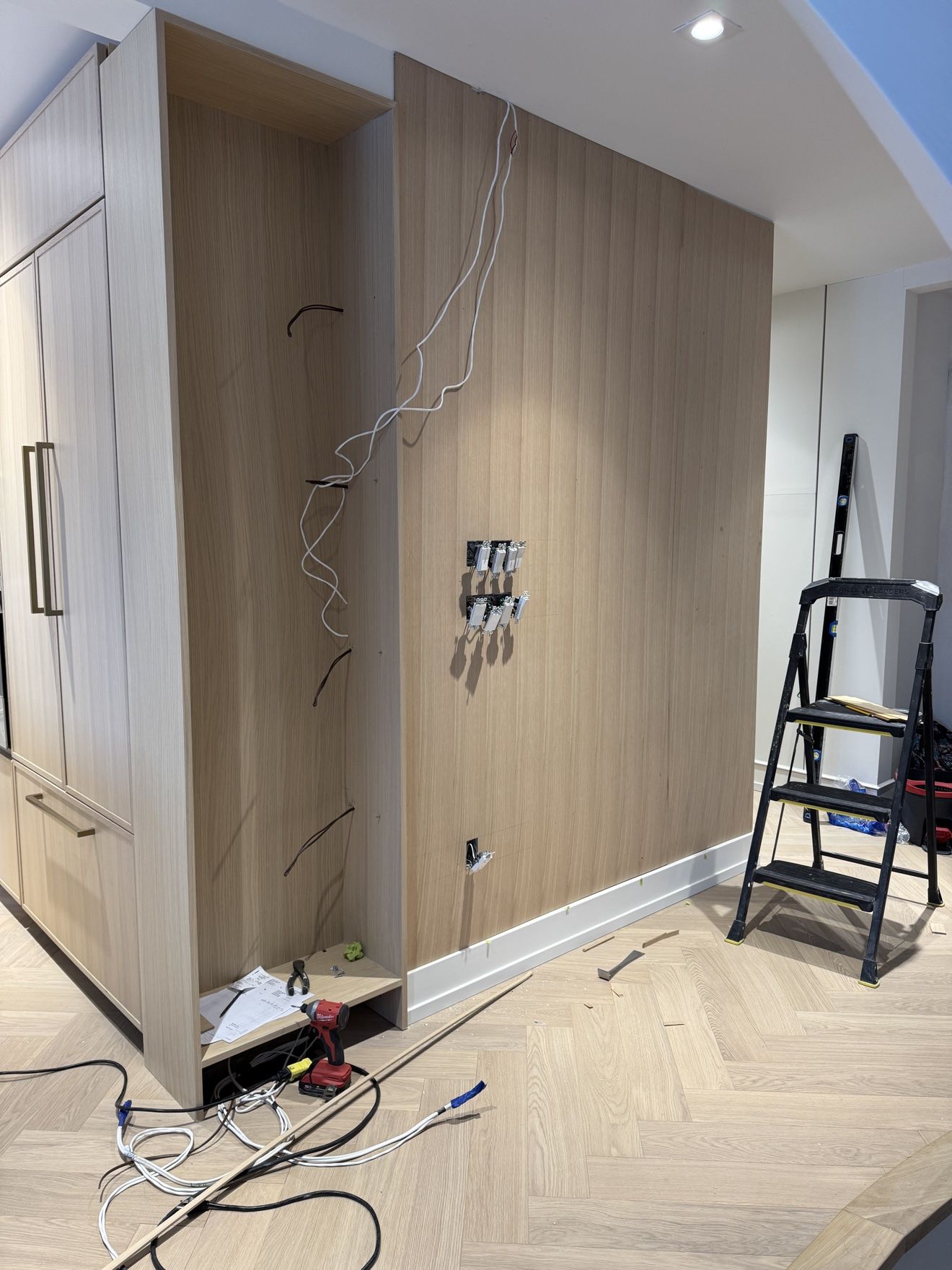 Oak wall panelling during installation, wiring for hidden lighting