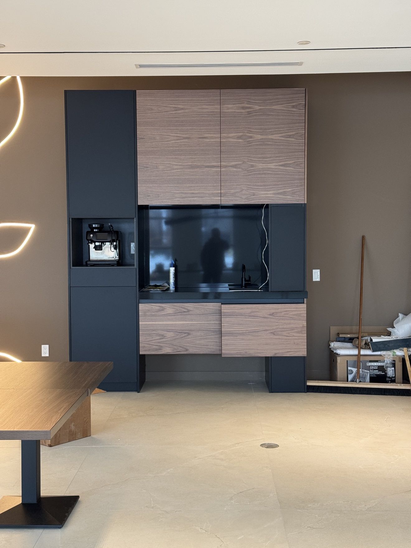 Office coffee bar in black and walnut, install in progress