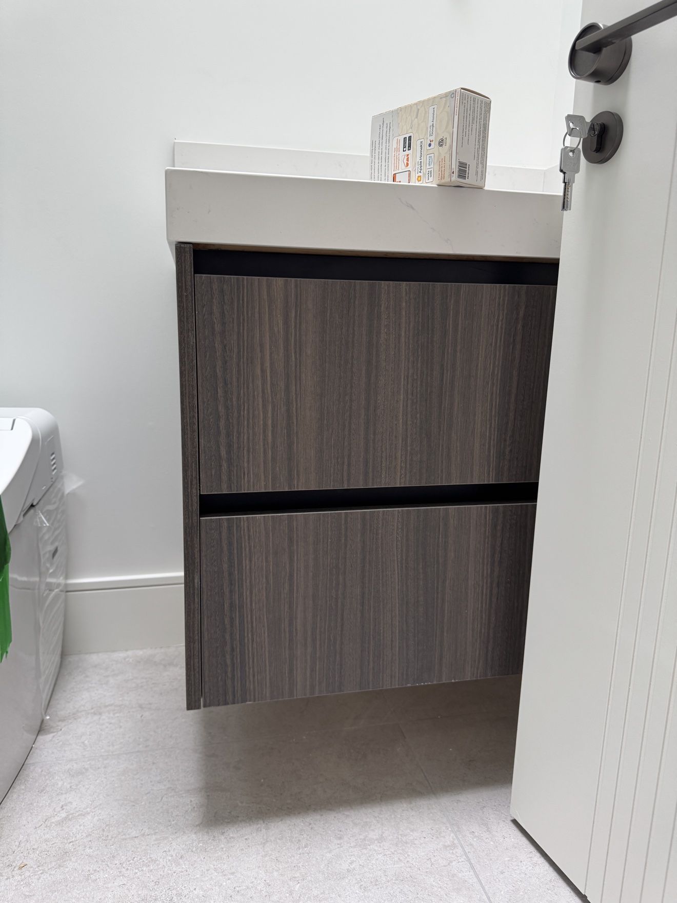 Floating walnut vanity in a powder room