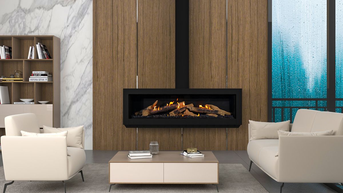 Ortal Wilderness Front 150 — wide frameless gas fireplace with driftwood logs on a wood-panel wall